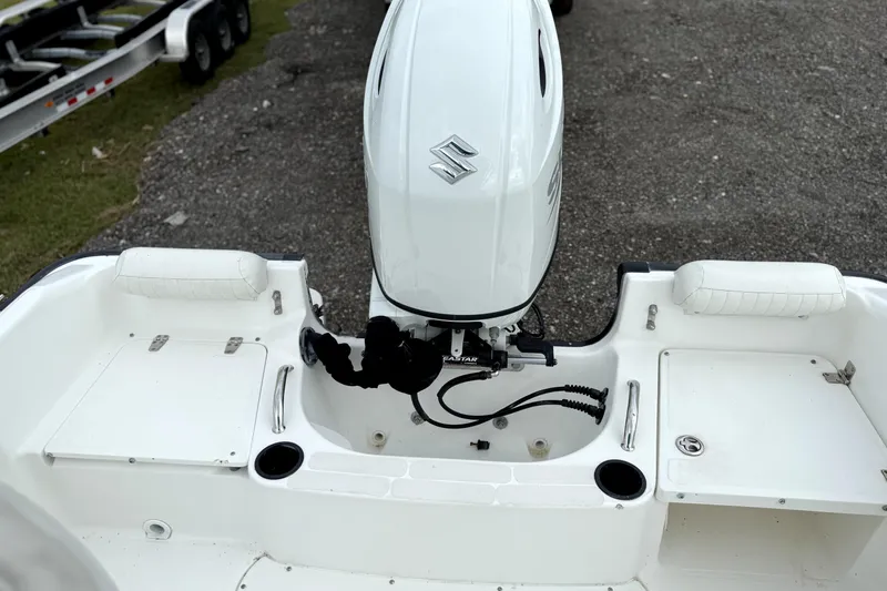 Slide: The Image of 2003 Boston Whaler 190 Nantucket boat with Suzuki outboard motor, rear view. - 5
