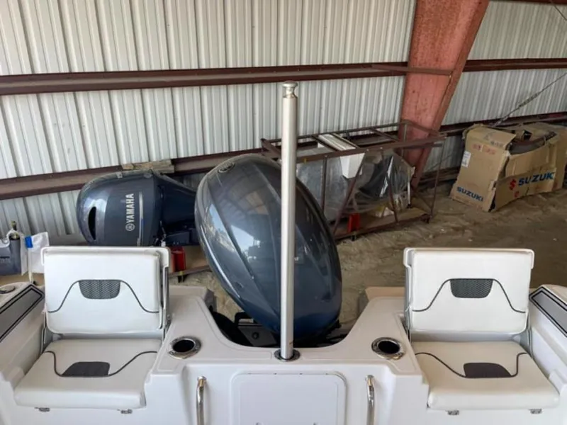 Slide: The Image of 2024 Wellcraft 202 Fisherman boat with Yamaha outboard motor in storage. - 12