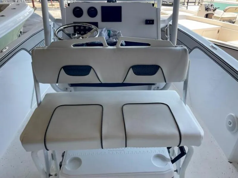 Slide: The Image of 2024 Wellcraft 202 Fisherman boat interior with dual seating and control console. - 9