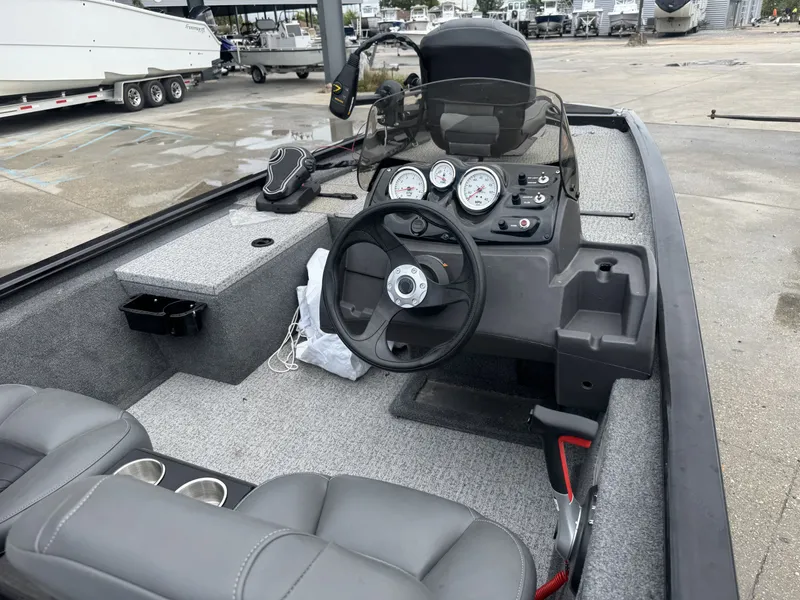 Slide: The Image of 2024 Tracker Pro 170 boat interior with steering wheel and dashboard controls. - 13