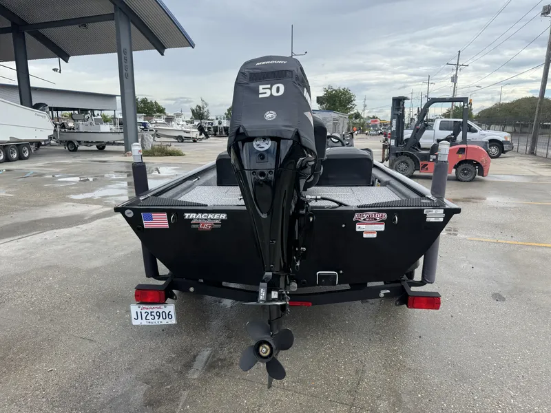 Slide: The Image of 2024 Tracker Pro 170 boat with Mercury 50 engine at a dealership. - 3