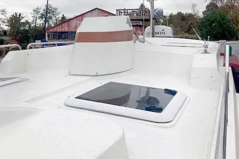 Slide: The Image of 2016 Ranger Tugs R-31 boat deck with hatch and Garmin equipment. - 10