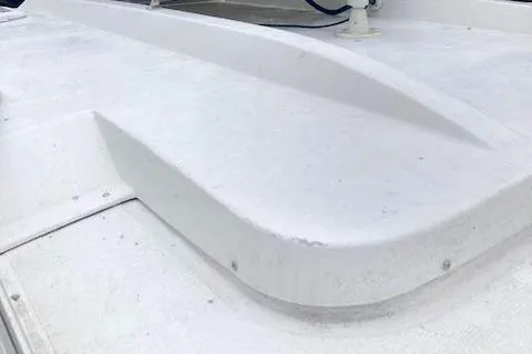 Slide: The Image of 2016 Ranger Tugs R-31 boat deck, showcasing sleek white design and structure. - 11