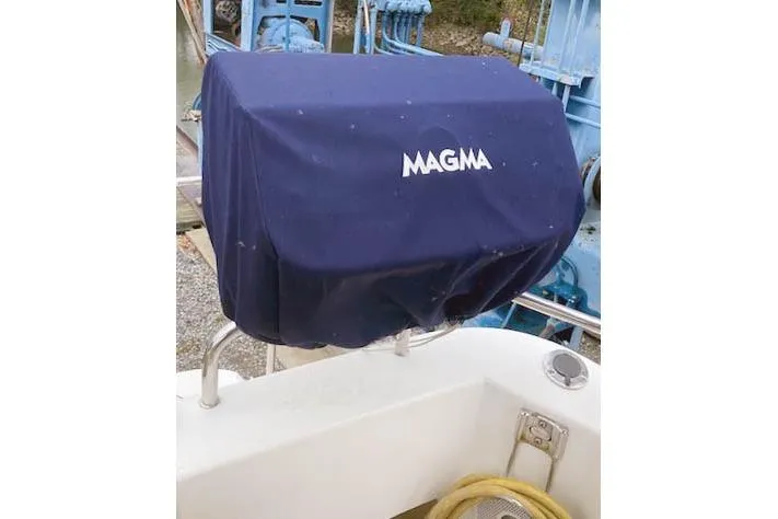Slide: The Image of Covered grill on 2016 Ranger Tugs R-31 boat deck, featuring Magma cover. - 12