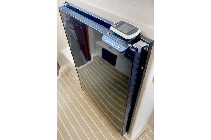 Slide: The Image of Nova Kool refrigerator on 2016 Ranger Tugs R-31 boat, with digital thermometer on top. - 21