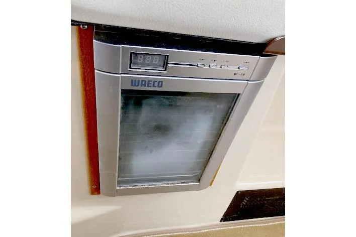 Slide: The Image of Built-in WAECO fridge in 2016 Ranger Tugs R-31 boat interior. - 26