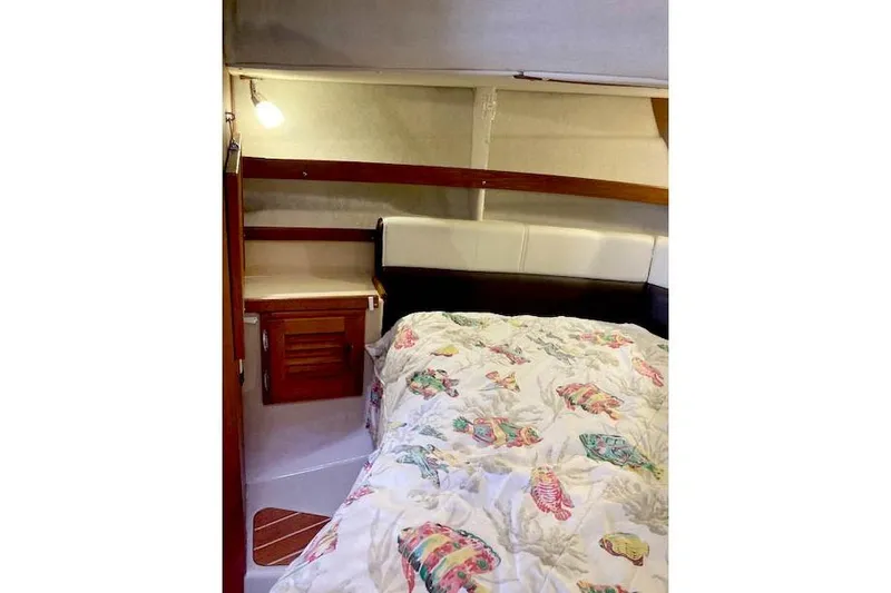 Slide: The Image of Cozy cabin interior of 2016 Ranger Tugs R-31 with colorful bedding. - 30