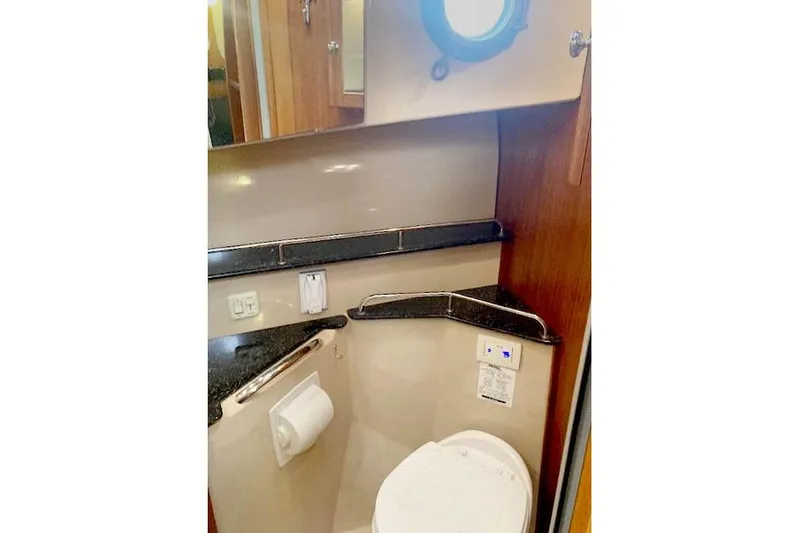 Slide: The Image of Bathroom interior of 2016 Ranger Tugs R-31 boat with porthole and modern fixtures. - 31