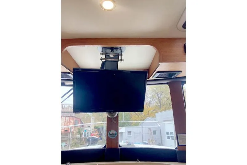Slide: The Image of Interior of 2016 Ranger Tugs R-31 with mounted TV and ceiling light. - 34