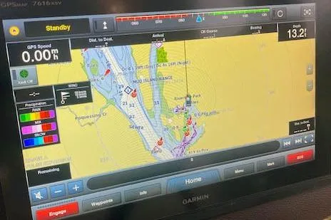 Slide: The Image of Garmin GPS navigation display on 2016 Ranger Tugs R-31 boat, showing detailed marine map. - 35