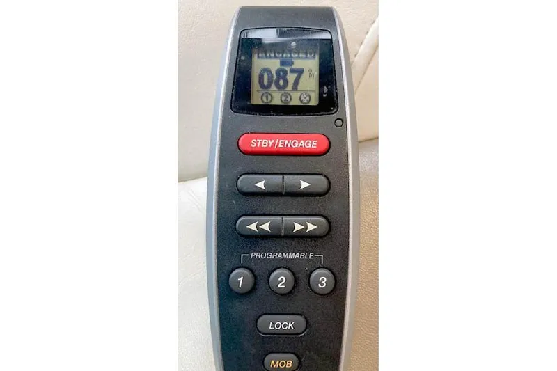 Slide: The Image of Remote control for 2016 Ranger Tugs R-31 boat, featuring navigation and programmable buttons. - 38