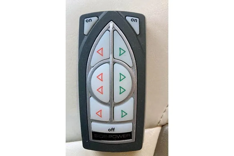 Slide: The Image of Remote control for 2016 Ranger Tugs R-31, featuring directional buttons and "Side-Power" branding. - 39