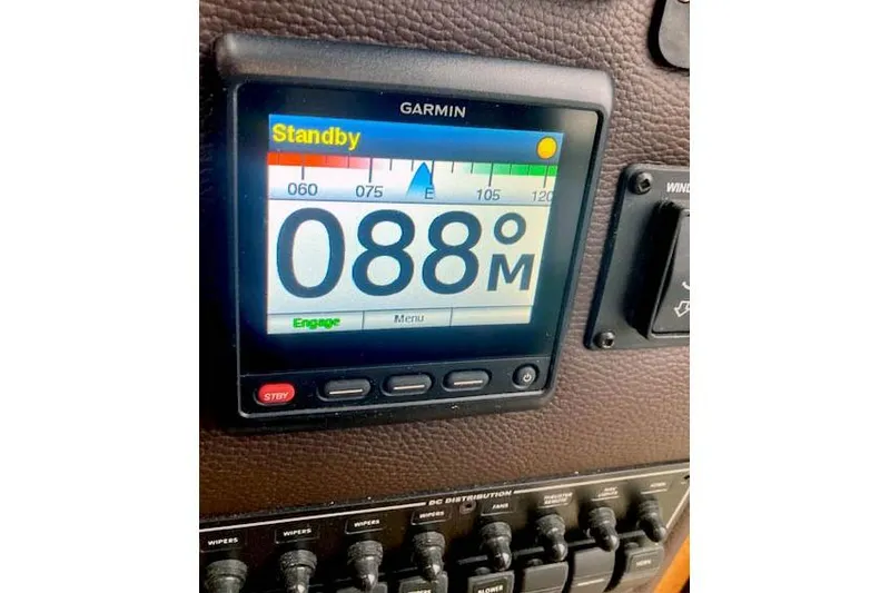 Slide: The Image of Garmin navigation display on 2016 Ranger Tugs R-31 boat dashboard, showing heading 088 degrees. - 42