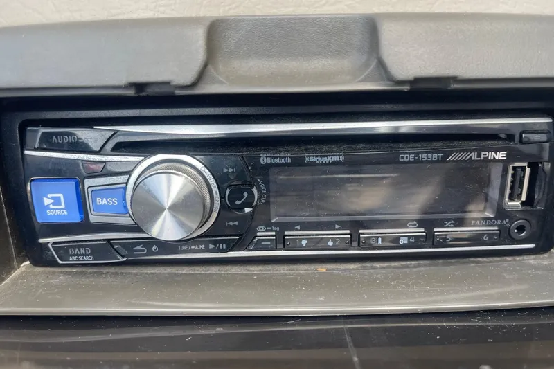 Slide: The Image of Alpine CDE-153BT stereo system in a 1996 Four Winns 200 Horizon boat. - 12