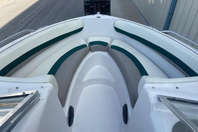 Slide: The Image of 1996 Four Winns 200 Horizon boat interior with white and green seating. - 13