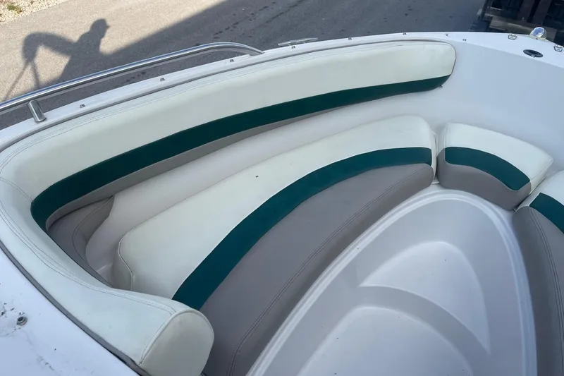 Slide: The Image of 1996 Four Winns 200 Horizon boat interior with white and green seating. - 15