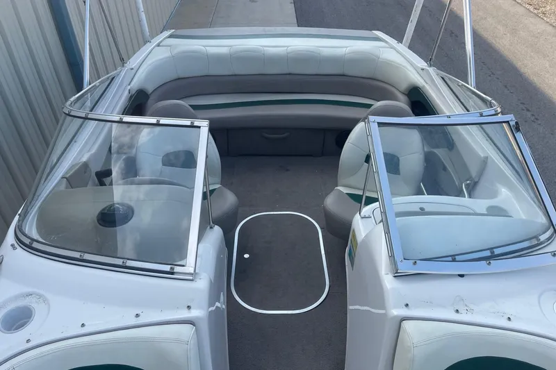 Slide: The Image of 1996 Four Winns 200 Horizon boat interior with seating and windshield. - 16