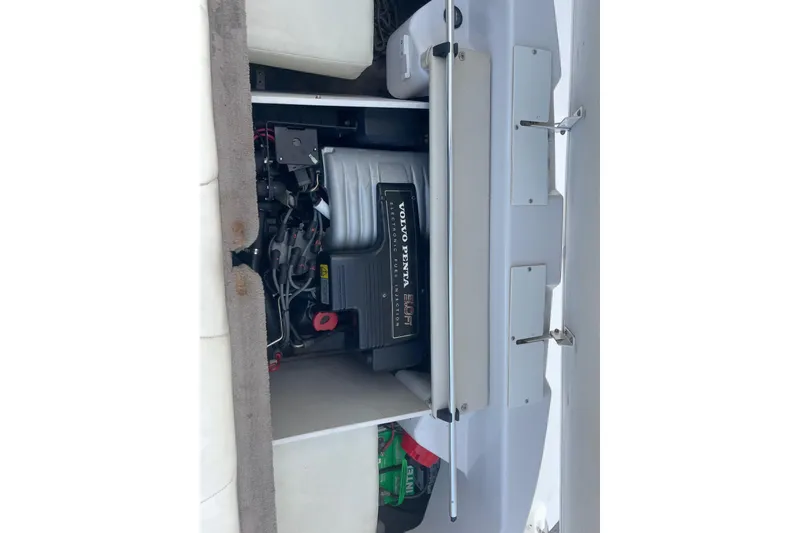 Slide: The Image of 1996 Four Winns 200 Horizon boat engine compartment with Volvo Penta engine visible. - 17