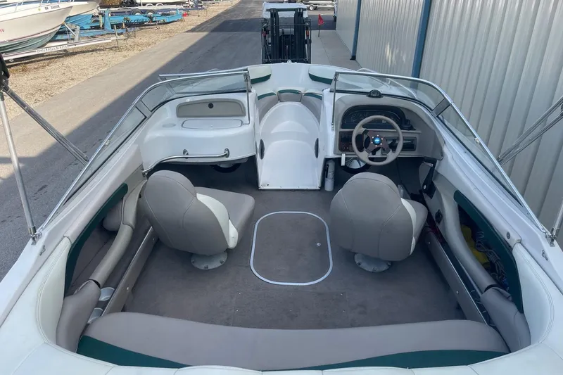 Slide: The Image of 1996 Four Winns 200 Horizon boat interior with seating and steering wheel. - 3