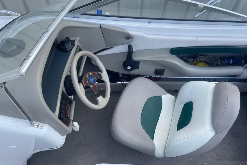 Slide: The Image of 1996 Four Winns 200 Horizon boat interior with steering wheel and seating. - 8