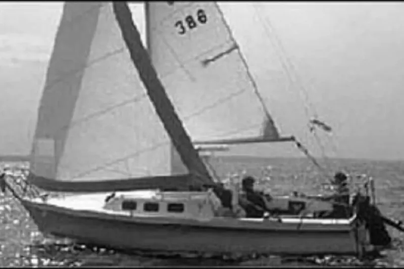 Slide: The Image of Sailboat on open water, Rhodes 22 model, 1986, with two people onboard. - 20
