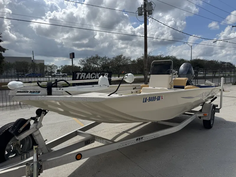 Slide: The Image of 2012 Xpress XP20CC boat on trailer, parked outdoors under cloudy sky. - 6
