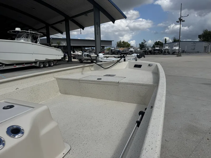 Slide: The Image of 2012 Xpress XP20CC boat in marina, under cloudy sky, with other boats nearby. - 8