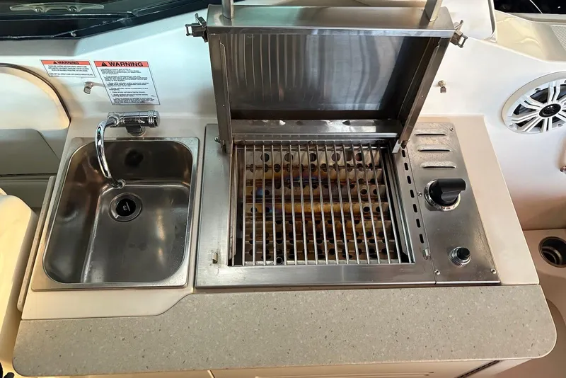 Slide: The Image of Stainless steel sink and grill on 2010 Sea Ray 300 SLX boat. - 17