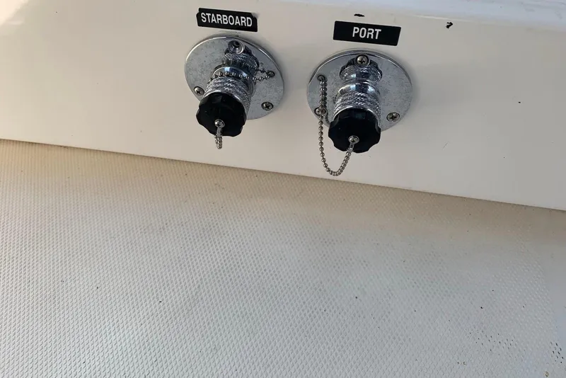 Slide: The Image of Fuel ports labeled "Starboard" and "Port" on 2010 Sea Ray 300 SLX boat. - 21