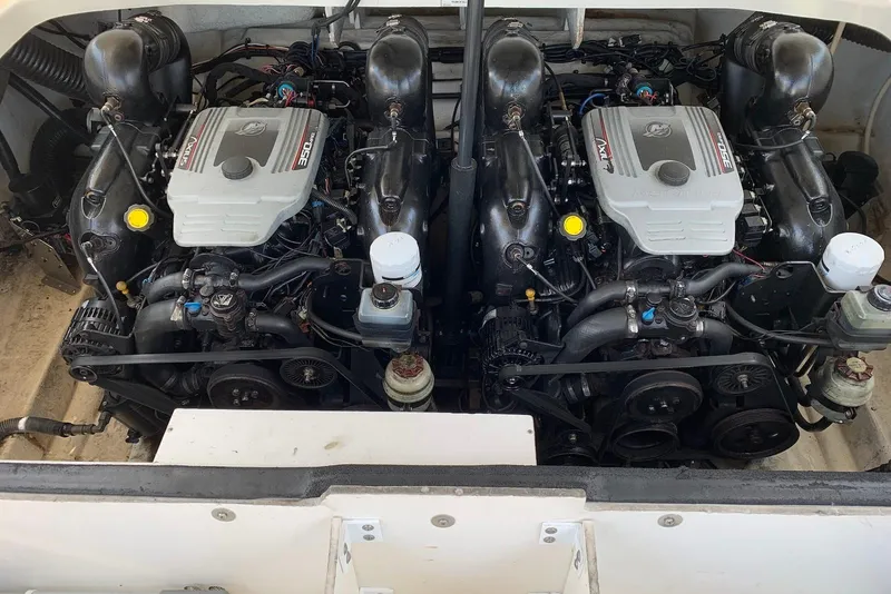 Slide: The Image of Twin engines of a 2010 Sea Ray 300 SLX boat, showcasing detailed mechanics. - 24