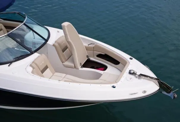 Slide: The Image of 2010 Sea Ray 300 SLX boat interior with open cockpit and marina view. - 3