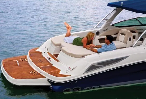 Slide: The Image of Cockpit of 2010 Sea Ray 300 SLX boat with steering wheel and control panel. - 4