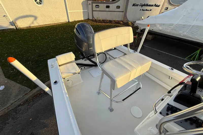 Slide: The Image of 2024 Parker 1801 Center Console boat with seating and outboard motor. - 10