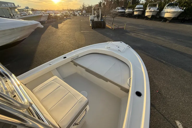 Slide: The Image of 2024 Parker 1801 Center Console boat in a marina at sunset. - 16