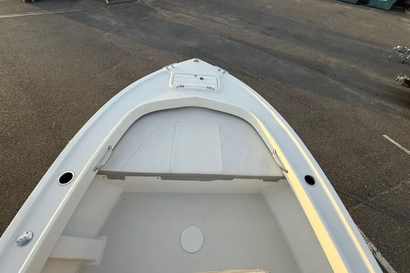 Slide: The Image of 2024 Parker 1801 Center Console boat, bow view, showcasing spacious deck and storage. - 18