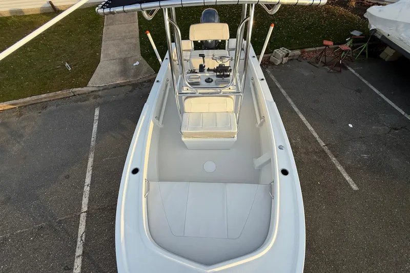 Slide: The Image of 2024 Parker 1801 Center Console boat, aerial view, parked on asphalt. - 20