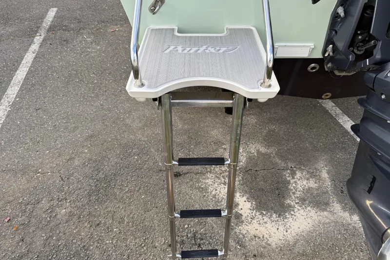 Slide: The Image of 2024 Parker 1801 Center Console boat ladder on asphalt surface. - 23