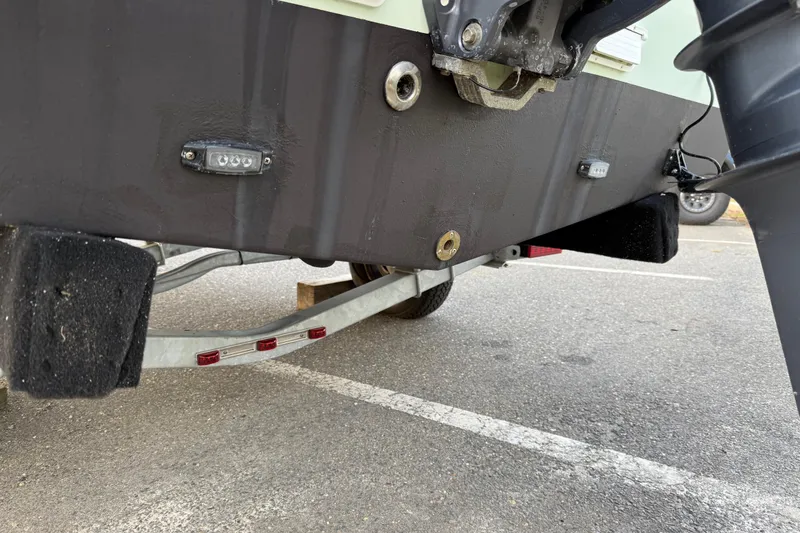 Slide: The Image of 2024 Parker 1801 Center Console boat on trailer, showing hull and trailer details. - 24