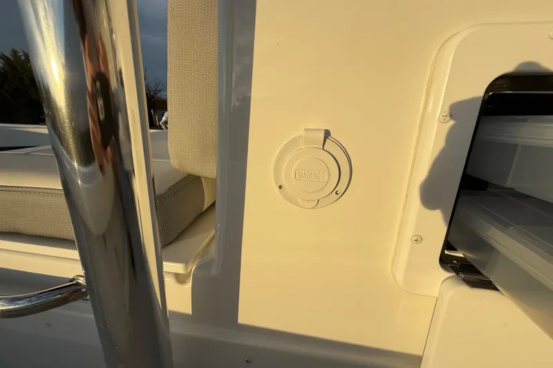 Slide: The Image of 2024 Parker 1801 Center Console boat interior with Marinco outlet and seating. - 28