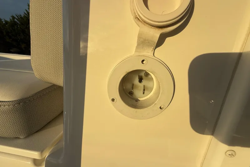 Slide: The Image of 2024 Parker 1801 Center Console boat power outlet detail in sunlight. - 29