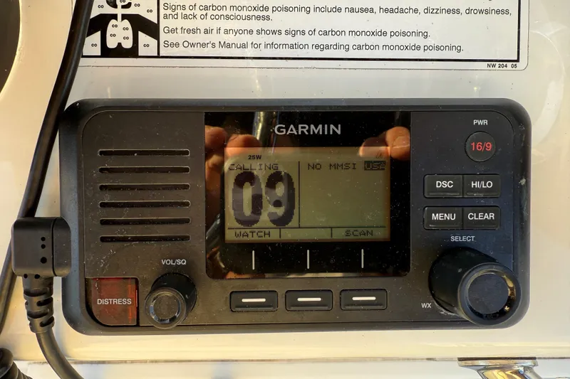 Slide: The Image of Garmin marine radio on 2024 Parker 1801 Center Console boat dashboard. - 32