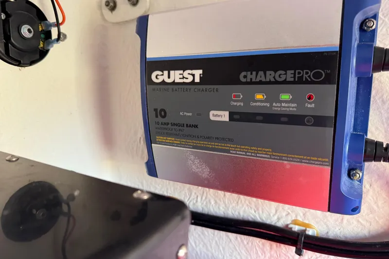 Slide: The Image of Marine battery charger in a 2024 Parker 1801 Center Console boat. - 34