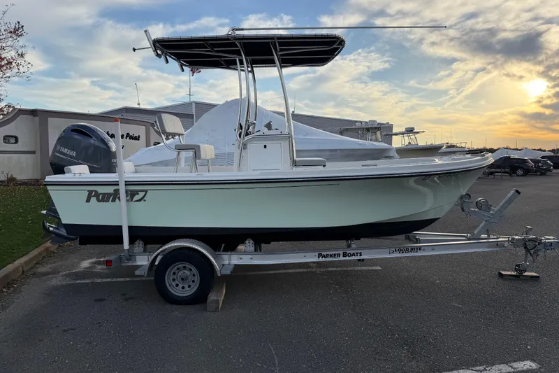 Slide: The Image of 2024 Parker 1801 Center Console boat on trailer at sunset, side view. - 4