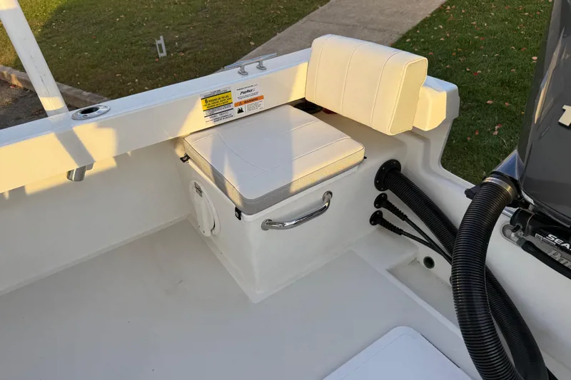 Slide: The Image of 2024 Parker 1801 Center Console boat interior with cushioned seating and storage. - 8