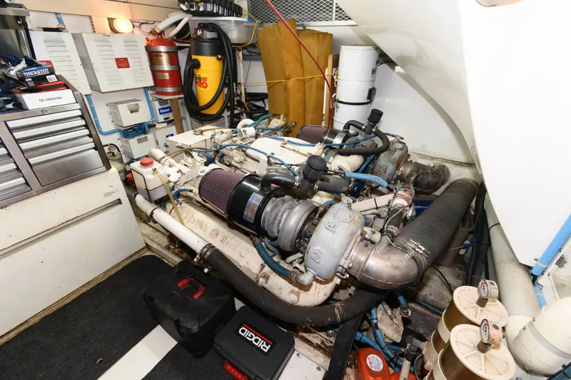 Slide: The Image of Engine room of 1989 Viking 55 Widebody Motor Yacht with visible machinery and equipment. - 15