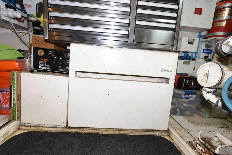 Slide: The Image of Engine room of 1989 Viking 55 Widebody Motor Yacht with tool storage and equipment. - 18