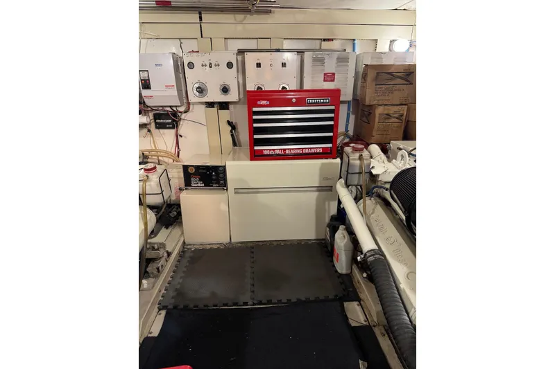 Slide: The Image of Engine room of 1989 Viking 55 Widebody Motor Yacht with tool chest and equipment. - 20