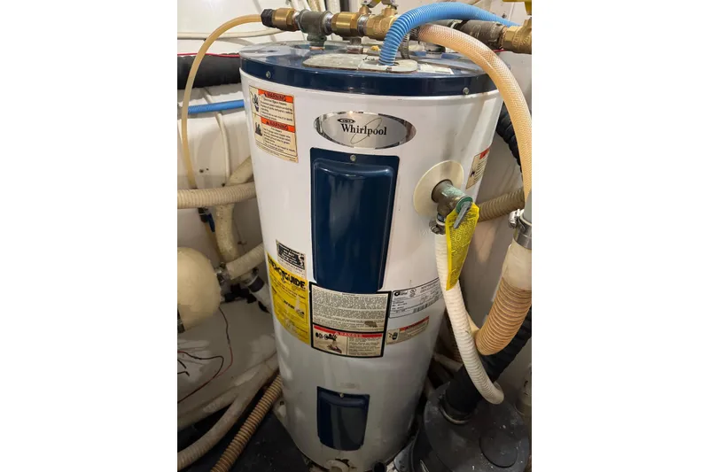 Slide: The Image of Whirlpool water heater in 1989 Viking 55 Widebody Motor Yacht engine room. - 23