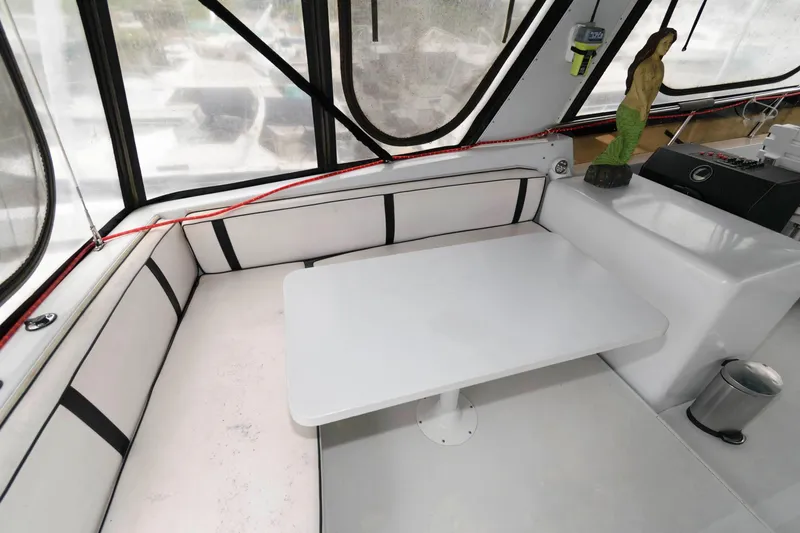 Slide: The Image of 1989 Viking 55 Widebody Motor Yacht helm with dual seats and navigation controls. - 6