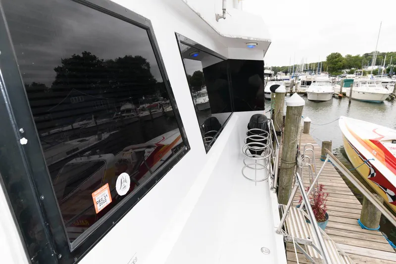 Slide: The Image of White and blue seating on 1989 Viking 55 Widebody Motor Yacht deck. - 9